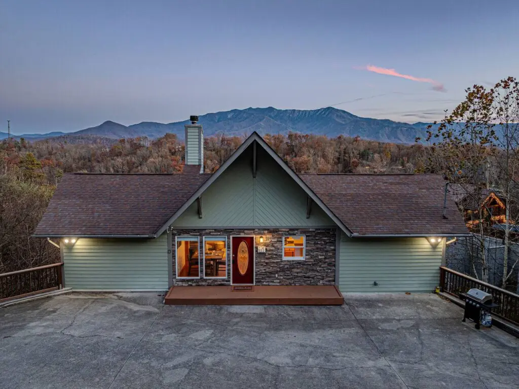 Cabin exterior at dusk in Chalet Village North