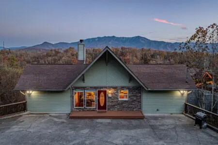 Cabin exterior at dusk in Chalet Village North