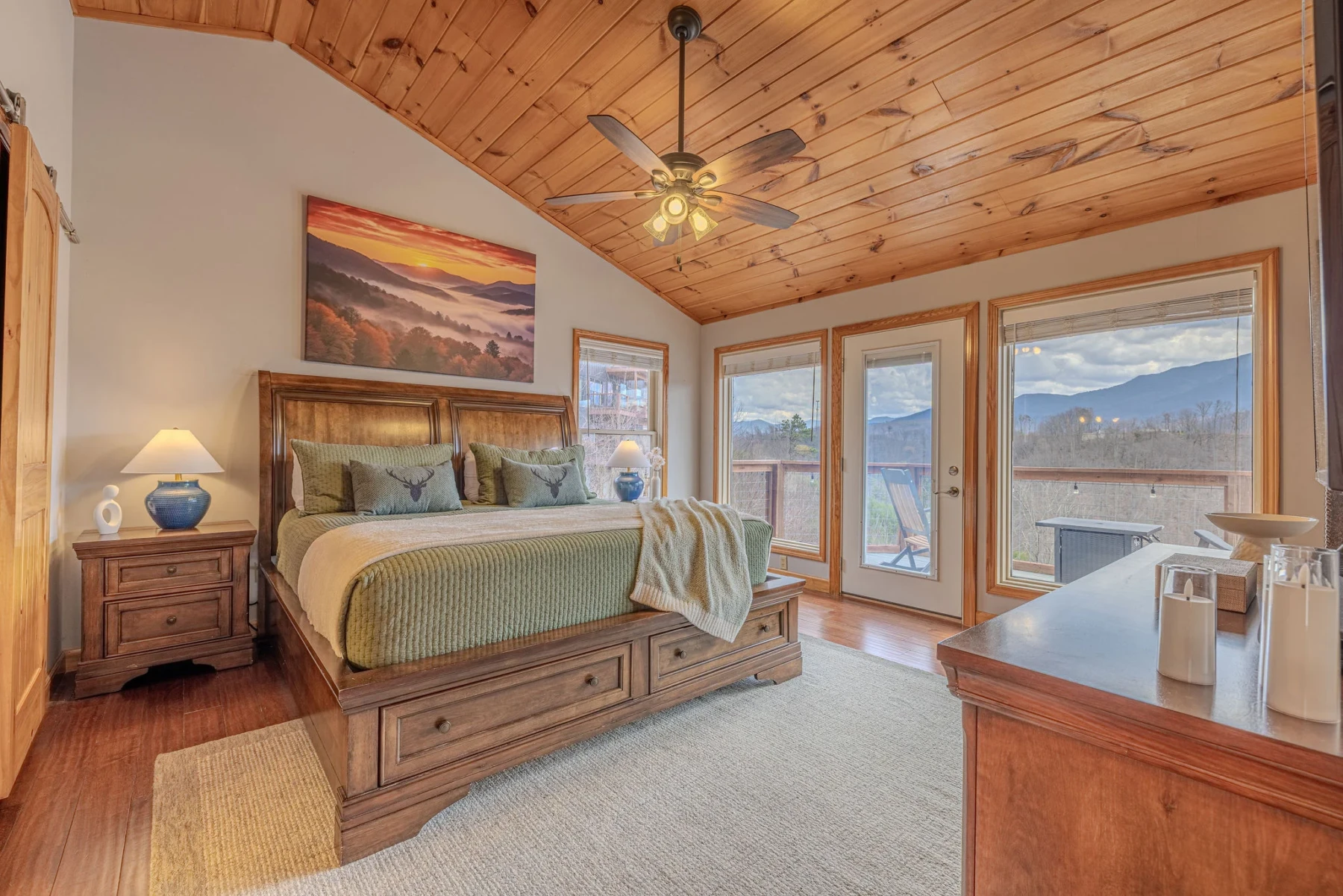 Master bedroom with mountain views and scenic balcony at Summit View Lodge in Gatlinburg