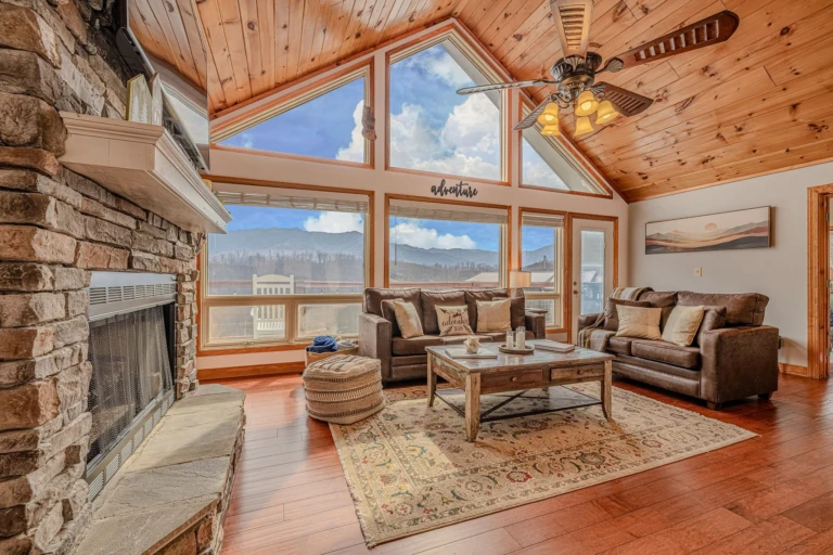 Modern living room with stone fireplace and mountain views where to stay in Gatlinburg TN