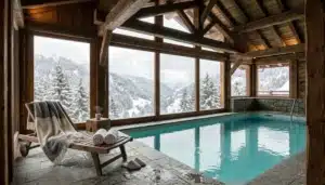 Private indoor pool inside a Gatlinburg cabin with timber beams and snowy forest windows, cabins in Gatlinburg Tennessee with indoor pool
